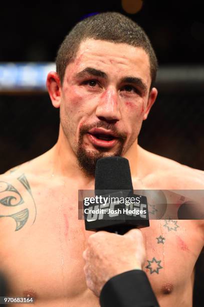 Robert Whittaker of New Zealand reacts after defeating Yoel Romero of Cuba in their middleweight fight during the UFC 225 event at the United Center...