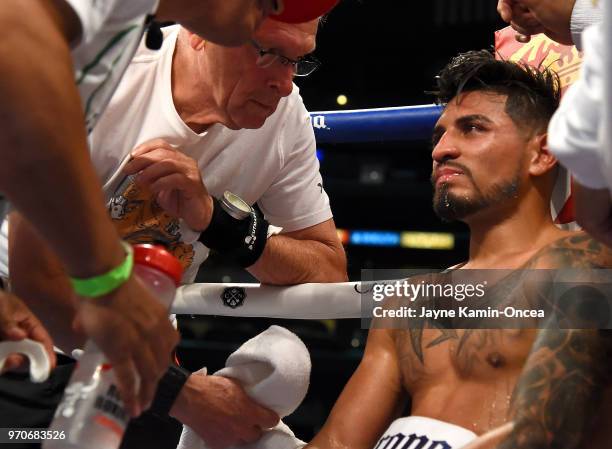 Abner Mares sits in his corner after being defeated by Leo Santa Cruz in their WBA Featherweight Title & WBC Diamond Title fight at Staples Center on...