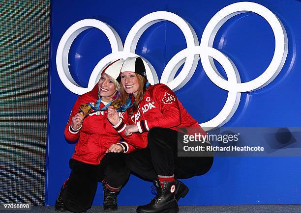 Kaillie Humphries and Heather Moyse of Canada celebrate receiving the gold medal during the medal ceremony for the women's bobsleigh held at the...