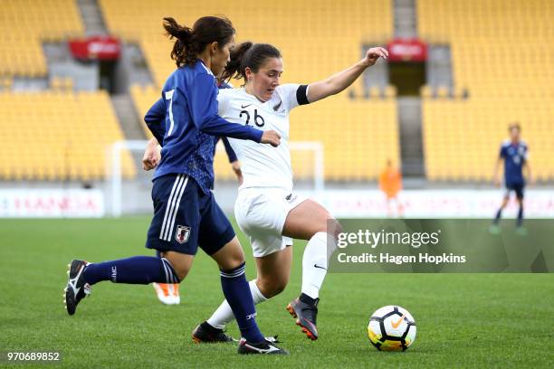 Sarah Morton of New Zealand defends against Emi Nakajima of Japan during the International Friendly match between the New Zealand Football Ferns and...