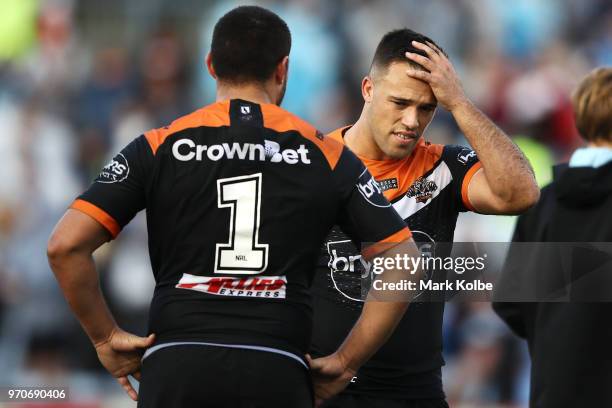 Tuimoala Lolohea and Luke Brooks of the Tigers look dejected after defeat during the round 14 NRL match between the Cronulla Sharks and the Wests...