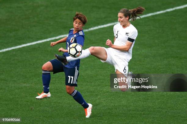 Rebekah Stott of New Zealand controls the ball while Mina Tanaka of Japan looks on during the International Friendly match between the New Zealand...