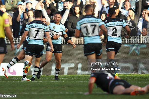 Jesse Ramien of the Sharks celebrates scoring a try during the round 14 NRL match between the Cronulla Sharks and the Wests Tigers at Southern Cross...