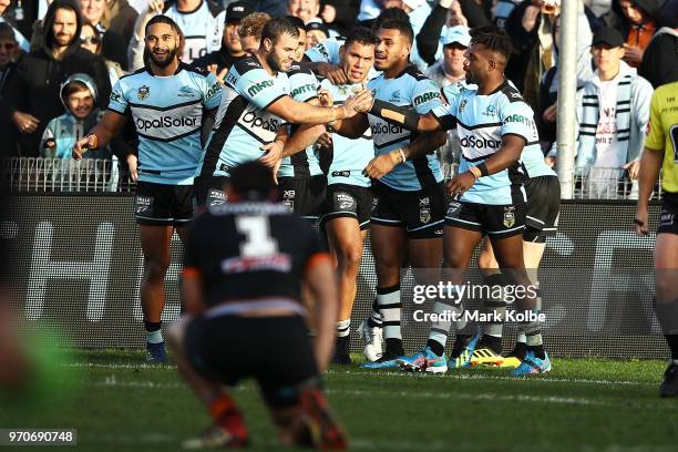 Jesse Ramien of the Sharks celebrates with his team mates after scoring a try during the round 14 NRL match between the Cronulla Sharks and the Wests...