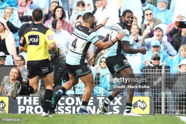 Ricky Leutele and Edrick Lee of the Sharks celebrate Edrick Lee scoring a try during the round 14 NRL match between the Cronulla Sharks and the Wests...