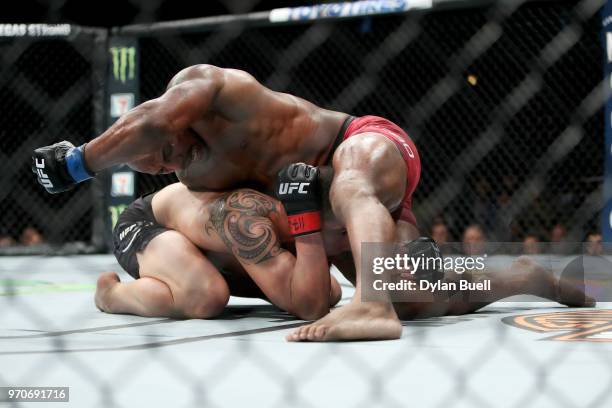 Yoel Romero of Cuba attempts a punch against Robert Whittaker of New Zealand in the third round in their middleweight title fight during the UFC 225:...