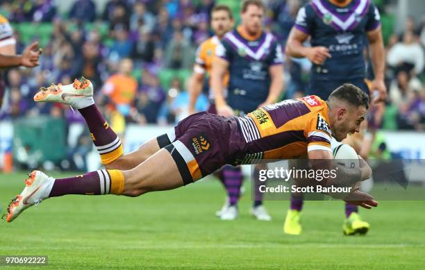 Darius Boyd of the Broncos scores the first try during the round 14 NRL match between the Melbourne Storm and the Brisbane Broncos at AAMI Park on...