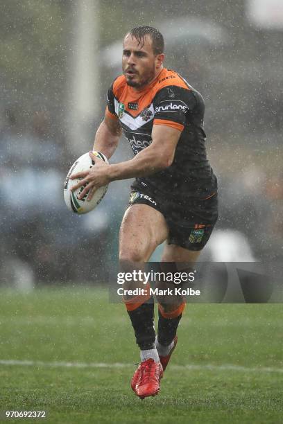 Josh Reynolds of the Tigers runs the ball during the round 14 NRL match between the Cronulla Sharks and the Wests Tigers at Southern Cross Group...