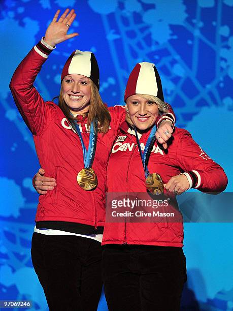 Heather Moyse and Kaillie Humphries of Canada celebrate receiving the gold medal during the medal ceremony for the women's bobsleigh held at the...