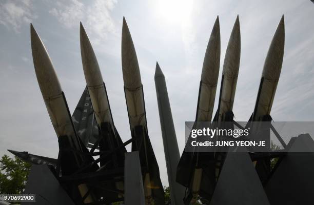 Replicas of North Korean Scud-B missile and South Korean Hawk surface-to-air missiles are displayed at the Korean War Memorial in Seoul on June 10,...