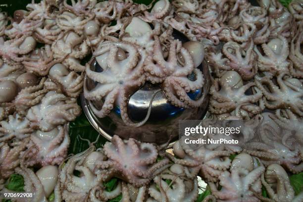 Stand with Grilled Baby Octopus for sale in Ayutthaya evening market. On Saturday, June 09 in Ayutthaya, Ayutthaya Province, Thailand.