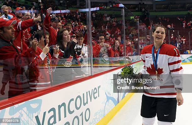 Jennifer Botterill of Canada celebrates with the fans after winning the gold medal during the ice hockey women's gold medal game between Canada and...