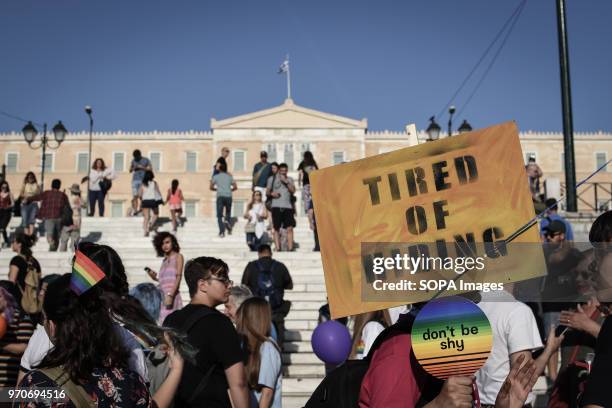 Placard seen front of the Greek Parliament at the festival. This year's Pride theme was discrimination against women, with transnational women...
