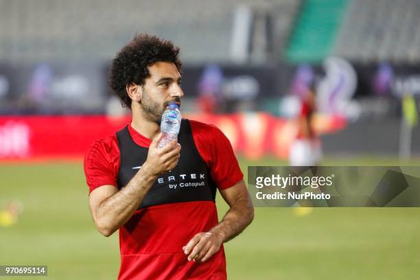 Egypts national team footballer and Liverpool's forward Mohamed Salah attends his teammates during Egyptian team in the final practice training...