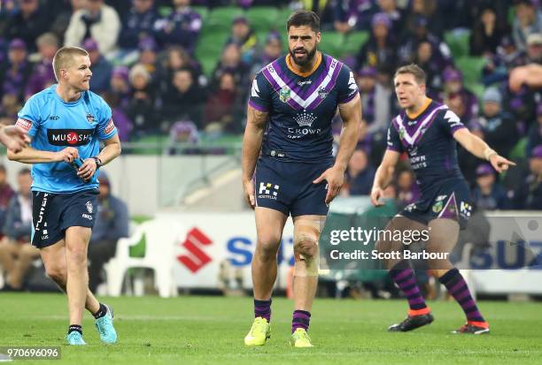 Jesse Bromwich of the Melbourne Storm leaves the field injured during the round 14 NRL match between the Melbourne Storm and the Brisbane Broncos at...