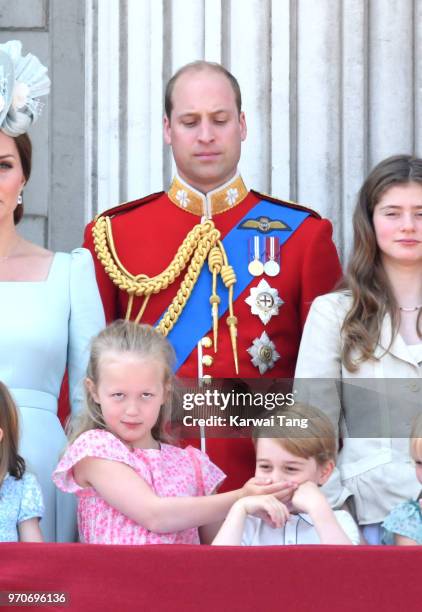 Prince William, Duke of Cambridge, Savannah Phillips and Prince George of Cambridge on the balcony of Buckingham Palace during Trooping The Colour...