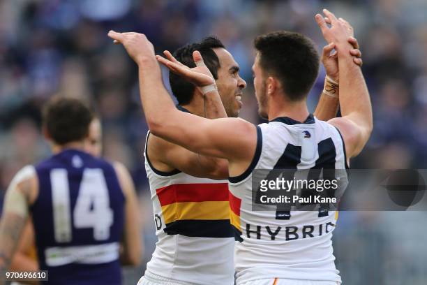 Eddie Betts and Lachlan Murphy of the Crows celebrate a goal during the round 12 AFL match between the Fremantle Dockers and the Adelaide Crows at...
