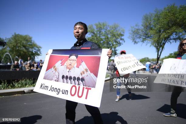 Protester denouncing North Korean leader Kim Jong-un during a rally to protest the G7 summit in Quebec City, Canada on 9 June 2018. During the last...