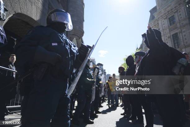 Masked protesters and riot police face off each other during a rally to protest the G7 summit in Quebec City, Canada on 9 June 2018. During the last...