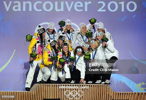 Team Germany receives the silver medal, Team Norway receives the gold medal and Team Finland receives the bronze medal during the medal ceremony for...