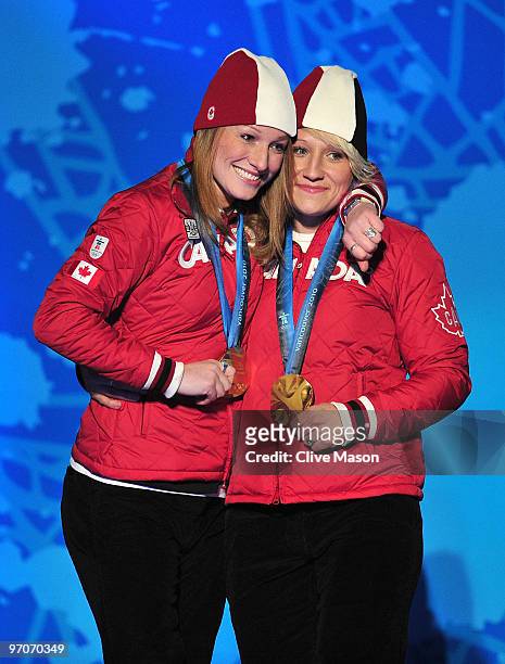Heather Moyse and Kaillie Humphries of Canada celebrate receiving the gold medal during the medal ceremony for the women's bobsleigh held at the...