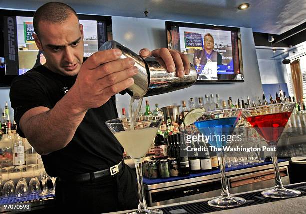 Bill O'Leary / TWP WASHINGTON, DC. The Skye Lounge, for our nightlife page. Pictured, mixologist Max Scozia puts together a patriotic trio of...