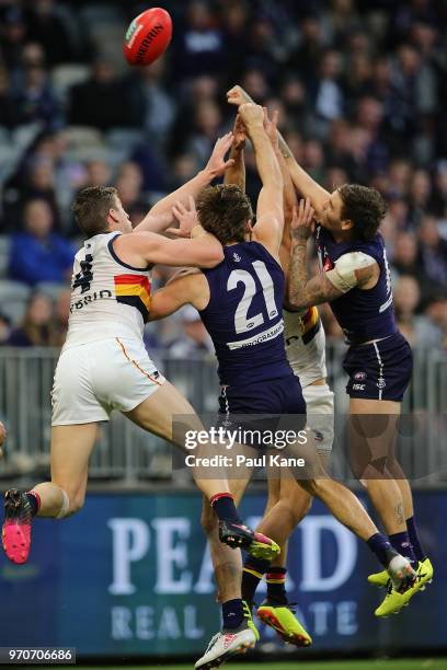 Nathan Wilson of the Dockers spoils the mark for Josh Jenkins of the Crows during the round 12 AFL match between the Fremantle Dockers and the...