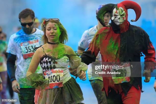 Participants take part in the Holi colors run in Moscow, Russia on June 10, 2018.