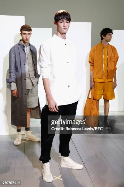 Models pose at the Phoebe English Presentation during London Fashion Week Men's June 2018 at BFC Show Space on June 10, 2018 in London, England.