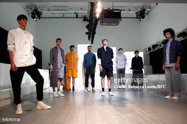 Models pose at the Phoebe English Presentation during London Fashion Week Men's June 2018 at BFC Show Space on June 10, 2018 in London, England.