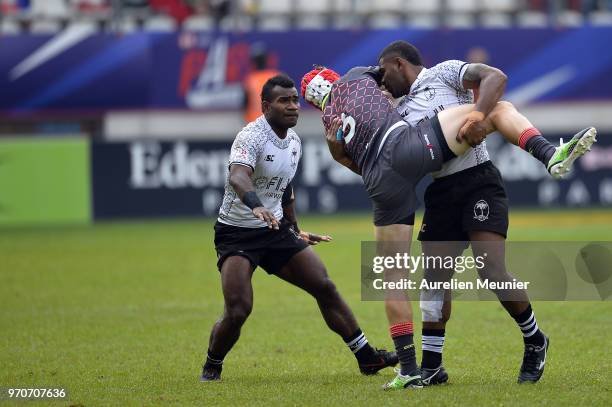 Phil Burgess of England is tackled during match between england and Fiji at the HSBC Paris Sevens, stage of the Rugby Sevens World Series at Stade...