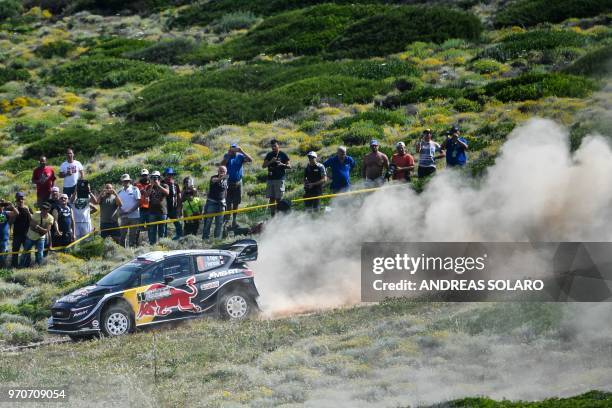 France's driver Sebastien Ogier and co-driver Julien Ingrassia drive their Ford Fiesta WRC during the 2018 FIA World Rally Championship on June 10,...