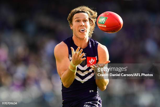 Ed Langdon of the Dockers takes a mark during the 2018 AFL round 12 match between the Fremantle Dockers and the Adelaide Crows at Optus Stadium on...
