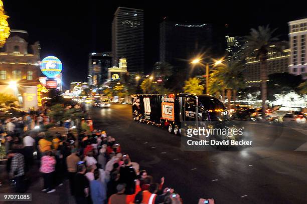 Racing fans cheers as NASCAR car haulers parade down the Las Vegas Strip Thursday, February 25, 2010 in Las Vegas, Nevada. Racers will compete in the...