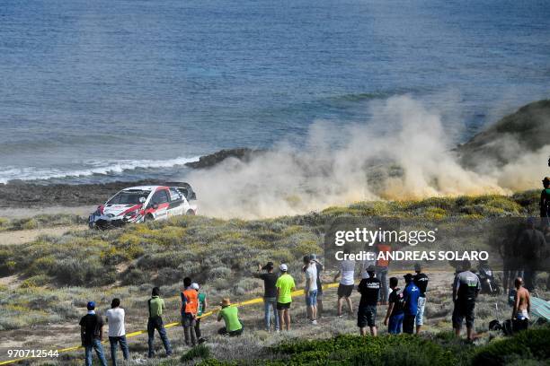 Finland's driver Jari-Matti Latvala and co-driver Miikka Anttila steer their Toyota Yaris WR during the 2018 FIA World Rally Championship on June 10,...