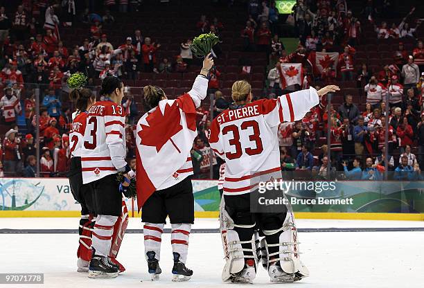 Charline Labonte, Caroline Ouellette, Marie-Philip Poulin,Kim St-Pierre of Canada celebrate with the gold medals following their team's 2-0 victory...