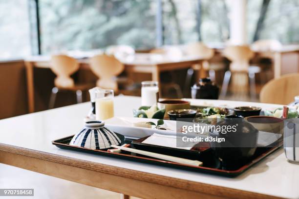 delicate japanese style meal freshly served on the table in a traditional restaurant - japanese restaurant stock pictures, royalty-free photos & images
