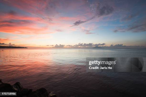 sunset by the sea - manado stock pictures, royalty-free photos & images