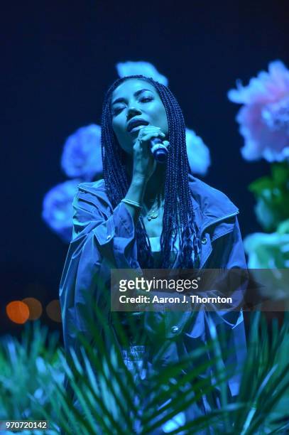 Singer Jhene Aiko performs on stage at Chene Park on June 9, 2018 in Detroit, Michigan.