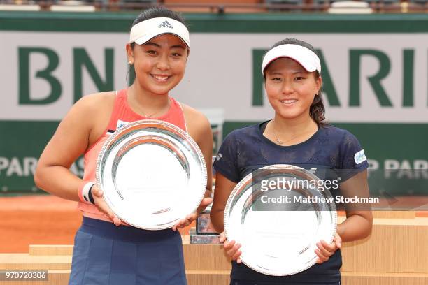 Eri Hozumi and Makoto Ninomiya of Japan celebrate with their runners up trophies following the ladies doubles final against Barbora Krejcikova and...