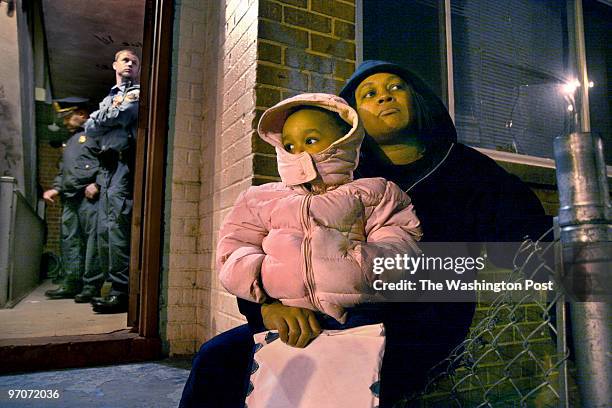 Housing Photos by Michael Williamson NEG#0003/06/08: PHOTOS FROM 3339 10th Place SE; THE HOME OF TRENTON ROBINSON: 2-year-old Trinity Robinson sits...