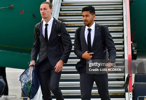 Australia football team's players Dimitri Petratos and Jackson Irvine disembark from an airplane as they arrive at Kazan airport on June 10 ahead of...