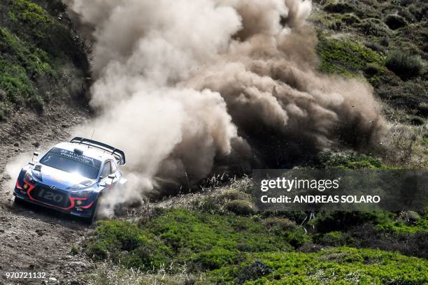 Belgium's driver Thierry Neuville and compatriot co-driver Nicolas Gilsoul steer their Hyundai i20 Coupe WRC, during the race at Argentiera, near...