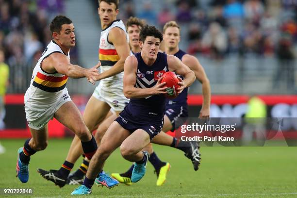 Andrew Brayshaw of the Dockers looks to pass the ball during the round 12 AFL match between the Fremantle Dockers and the Adelaide Crows at Optus...