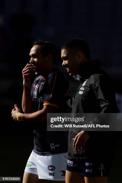 Eddie Betts of the Crows and Michael Walters of the Dockers talk before during the round 12 AFL match between the Fremantle Dockers and the Adelaide...