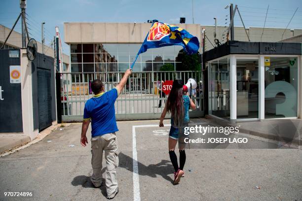 People attend a demonstration called by far-right groups under the slogan "For the closure of TV3" in front of the Catalan public televison "TV3"...