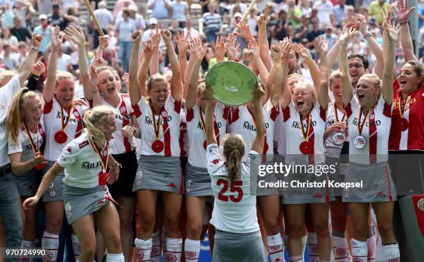 The team of der Club an der Alster Hamburg celebrates winning the German Championships after winning 3-1 the ladies final match between Club an der...