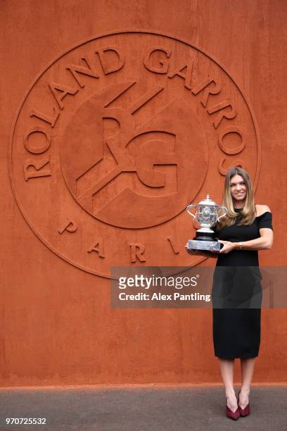 Ladies singles winner, Simona Halep of Romania poses with the Suzanne Lenglen trophy during day fifteen of the 2018 French Open at Roland Garros on...