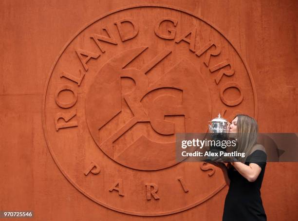 Ladies singles winner, Simona Halep of Romania kisses the Suzanne Lenglen trophy during day fifteen of the 2018 French Open at Roland Garros on June...