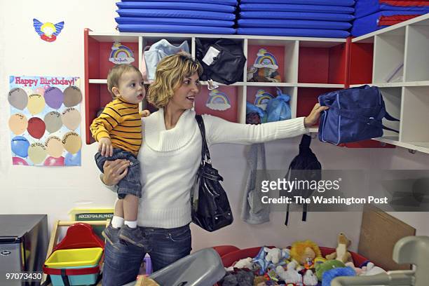 Josephm 200683--SLUG-medaycare--DATE-04/09/08-- Alexandria, Virginia-PHOTOGRAPHER-MARVIN JOSEPH/TWP-- Poli Marinova picks up her 13-month-old son...